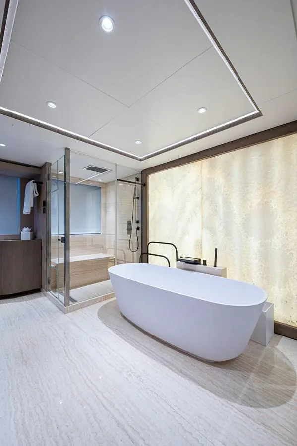 Slide: The Image of Luxurious Majesty 140 yacht bathroom, 2020 model, featuring modern bathtub and glass shower. - 50