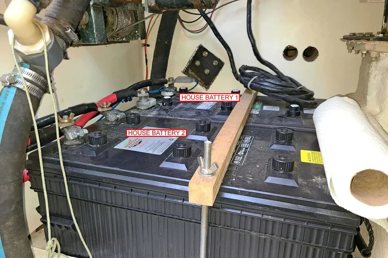 Slide: The Image of 1984 Shannon 51' Center Cockpit boat batteries labeled "House Battery 1" and "House Battery 2". - 26