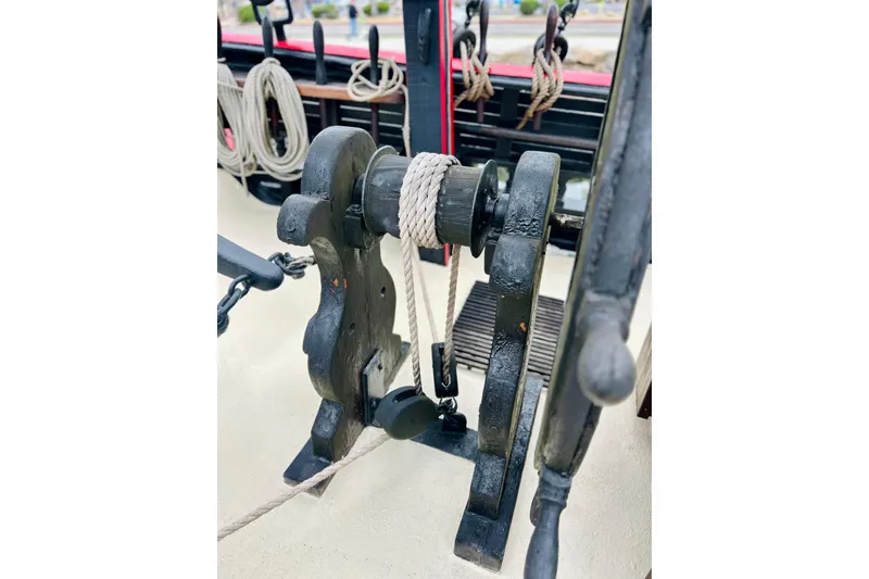 Slide: The Image of Close-up of a 1977 Custom Brigantine ship's winch with ropes and pulleys. - 12