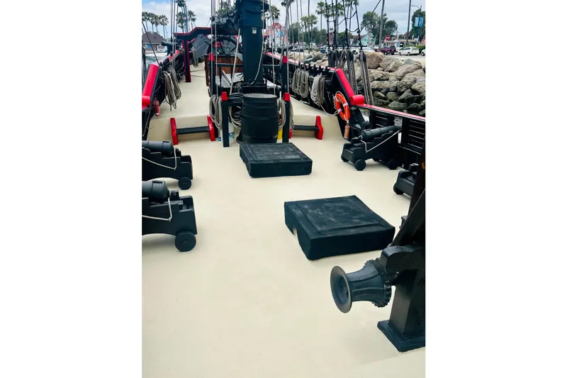 Slide: The Image of Deck of a 1977 Custom Brigantine ship with cannons and nautical equipment. - 25