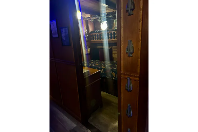 Slide: The Image of Cozy wooden cabin interior on a 1977 Custom Brigantine ship. - 45