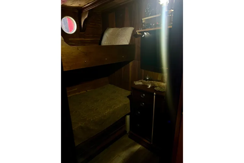 Slide: The Image of Cozy wooden cabin interior with bunk beds on a 1977 Custom Brigantine. - 47