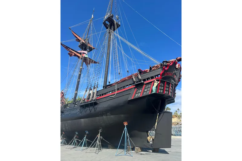 Slide: The Image of Vintage 1977 Custom 80 Brigantine ship with intricate rigging and decorative figurehead. - 62