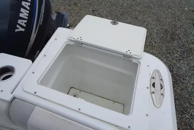 Slide: The Image of Open storage compartment on 2008 Triumph 235 CC boat with Yamaha engine. - 10