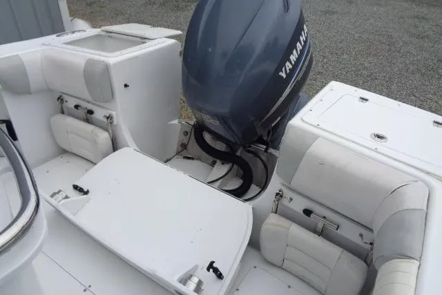 Slide: The Image of 2008 Triumph 235 CC boat with Yamaha outboard motor and white seating. - 12
