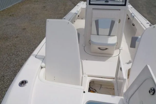 Slide: The Image of 2008 Triumph 235 CC boat interior with seating and storage compartments. - 23