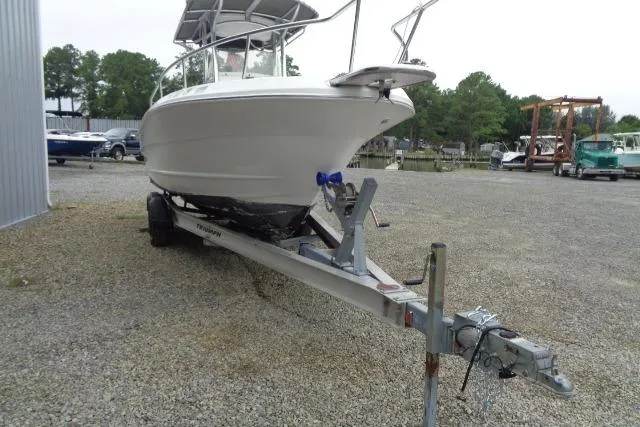 Slide: The Image of 2008 Triumph 235 CC boat on trailer in outdoor storage area. - 7