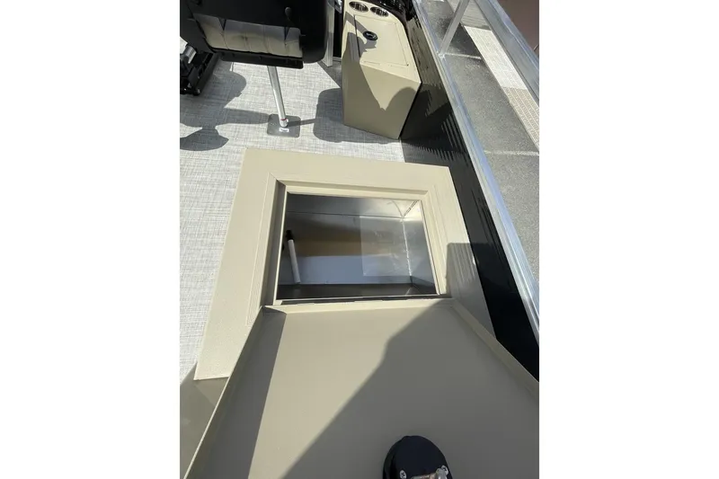 Slide: The Image of 2024 Lowe Ultra 202 Fish & Cruise boat interior with open storage compartment. - 13