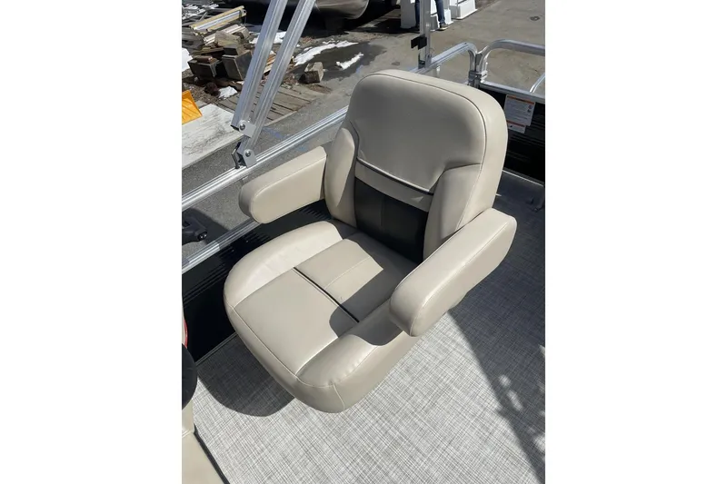 Slide: The Image of 2024 Lowe Ultra 202 Fish & Cruise boat seat, beige upholstery, outdoor setting. - 17
