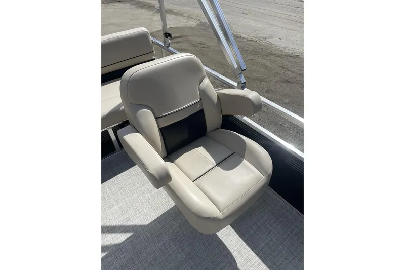 Slide: The Image of 2024 Lowe Ultra 202 Fish & Cruise boat seat, beige upholstery, armrests, outdoor setting. - 18