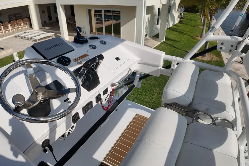Slide: The Image of 2018 Everglades 335 Center Console boat helm with Garmin navigation system. - 20