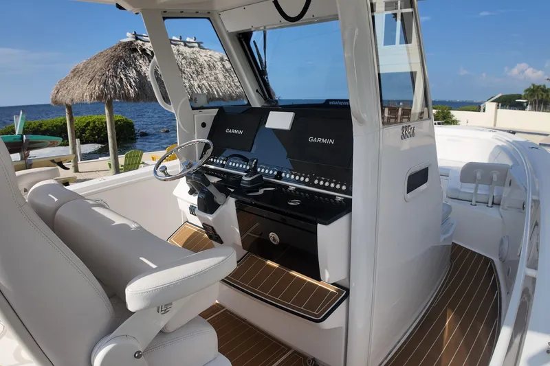 Slide: The Image of 2018 Everglades 335 Center Console boat interior with Garmin navigation system. - 25