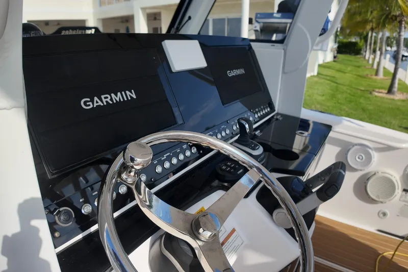 Slide: The Image of Control panel of 2018 Everglades 335 Center Console with Garmin displays. - 26