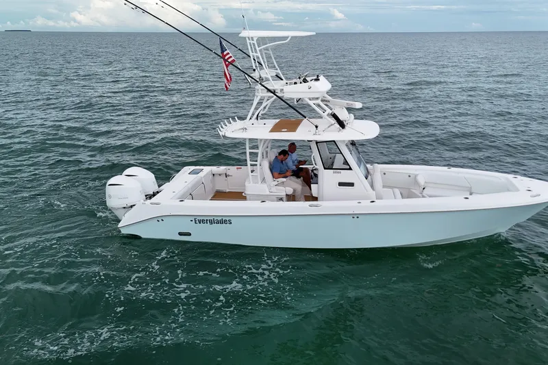 Slide: The Image of 2018 Everglades 335 Center Console boat cruising on open water. - 6