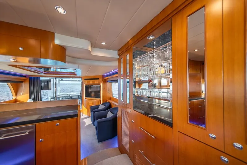 Slide: The Image of Luxurious interior of 2009 Horizon 73 yacht with wooden cabinetry and modern amenities. - 15