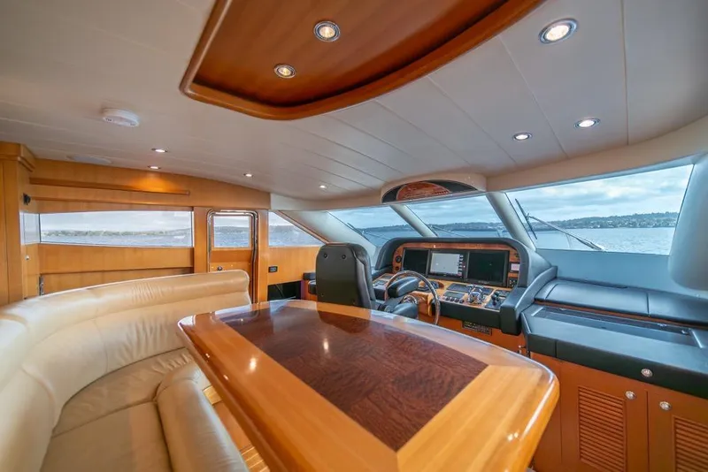 Slide: The Image of Luxurious interior of 2009 Horizon 73 yacht with elegant wood finishes and panoramic windows. - 23