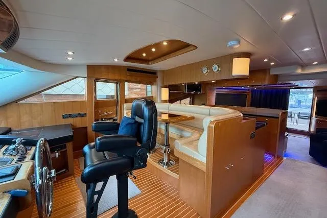 Slide: The Image of Luxurious interior of a 2009 Horizon 73 yacht with modern helm and seating area. - 25