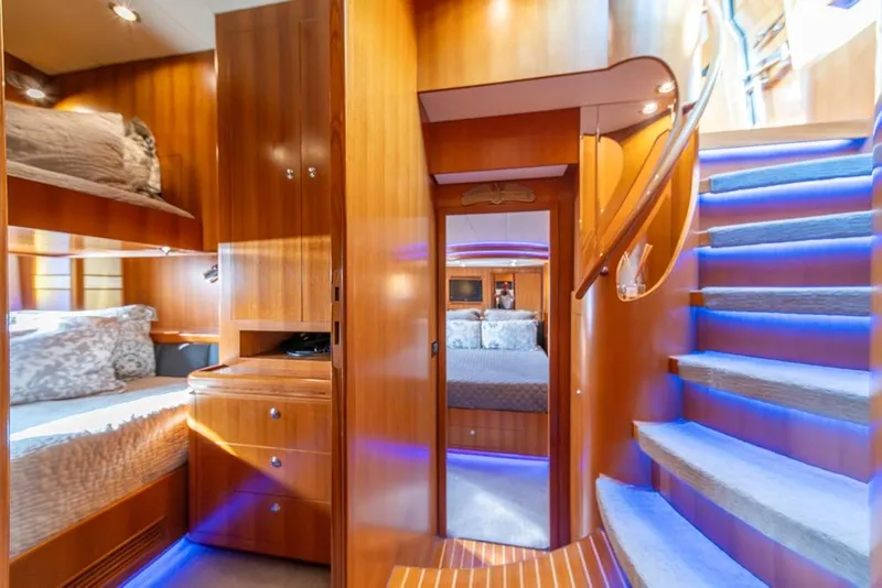 Slide: The Image of Luxurious 2009 Horizon 73 yacht interior with wooden finishes and blue LED lighting. - 37