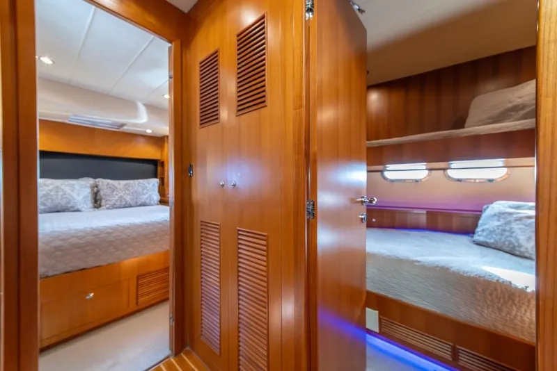Slide: The Image of Luxurious interior of 2009 Horizon 73 yacht with cozy bedrooms and wooden finishes. - 38