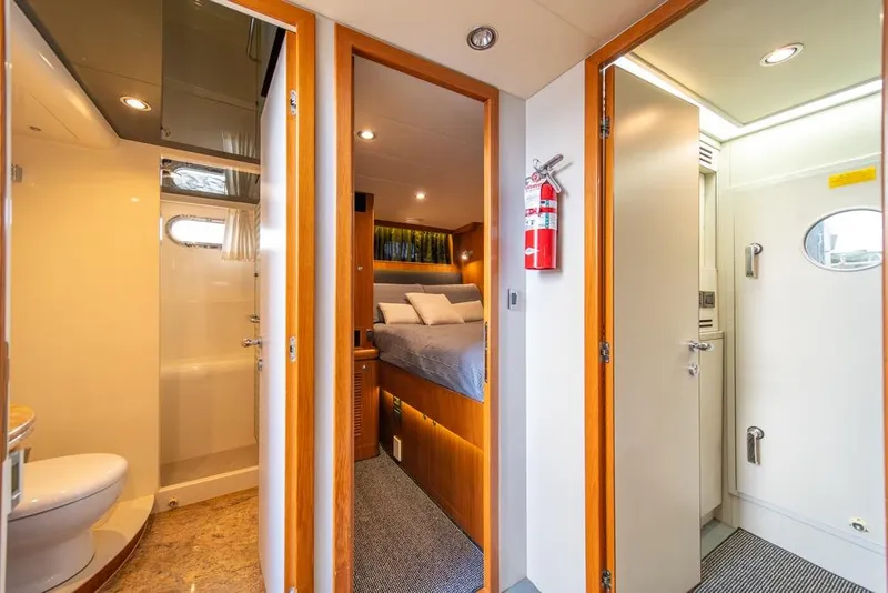 Slide: The Image of Luxurious interior of 2009 Horizon 73 yacht featuring bedroom and bathroom. - 41