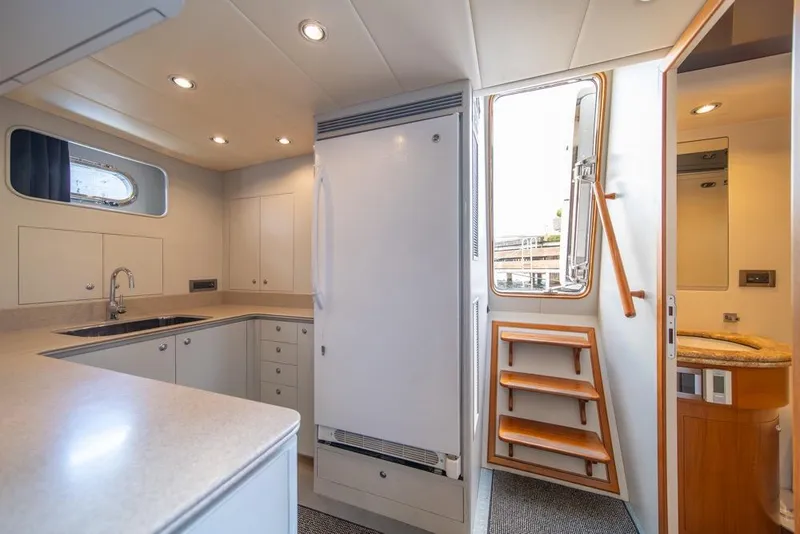Slide: The Image of Luxurious kitchen interior of 2009 Horizon 73 yacht with modern amenities and elegant design. - 43