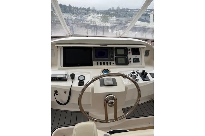 Slide: The Image of Helm of 2009 Horizon 73 yacht with navigation controls and steering wheel. - 46