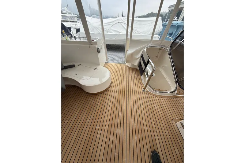 Slide: The Image of Teak deck of 2009 Horizon 73 yacht, featuring sleek design and modern amenities. - 50