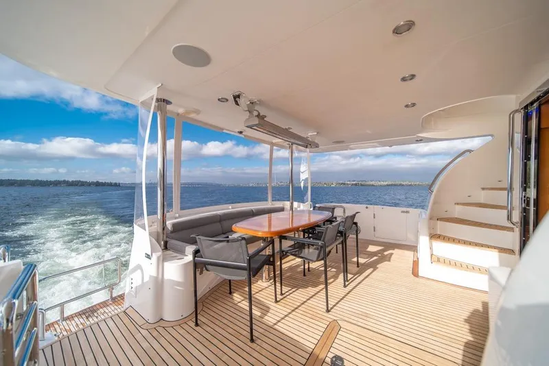 Slide: The Image of Luxurious Horizon 73 yacht deck with seating, table, and ocean view, 2009 model. - 58