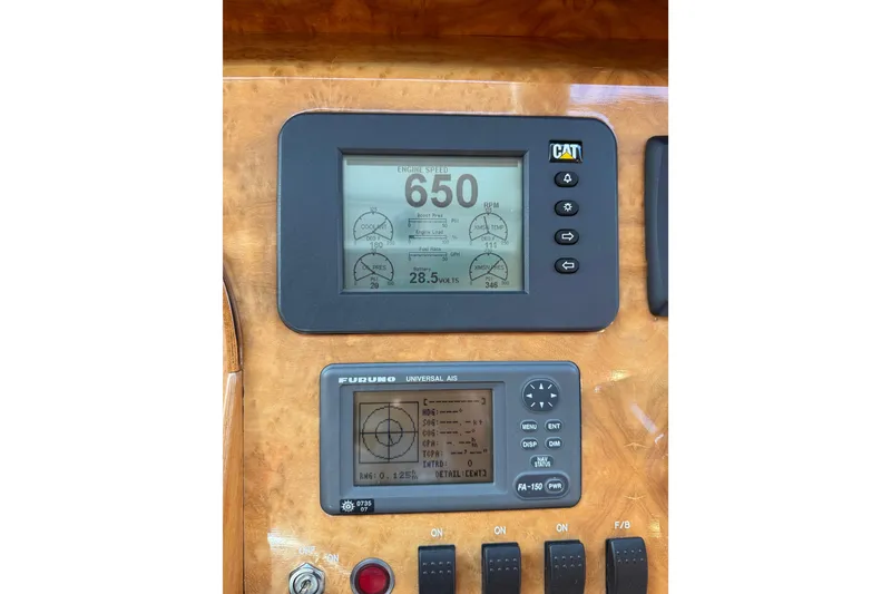 Slide: The Image of Control panel of a 2009 Horizon 73 yacht with CAT and Furuno displays. - 67