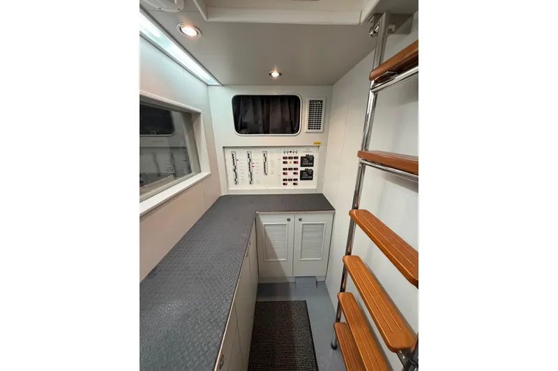 Slide: The Image of Modern interior of 2009 Horizon 73 yacht with control panel and wooden ladder. - 68