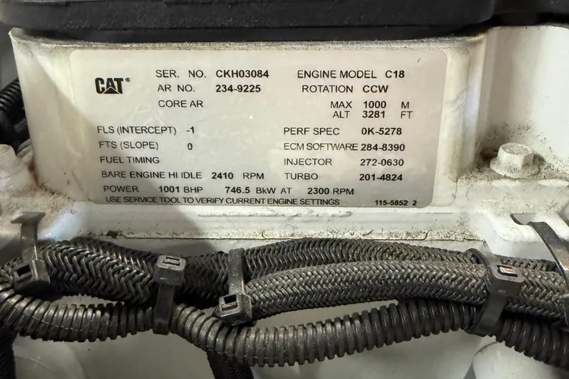 Slide: The Image of Engine specifications label on a CAT C18, Horizon 73, 2009 model. - 81