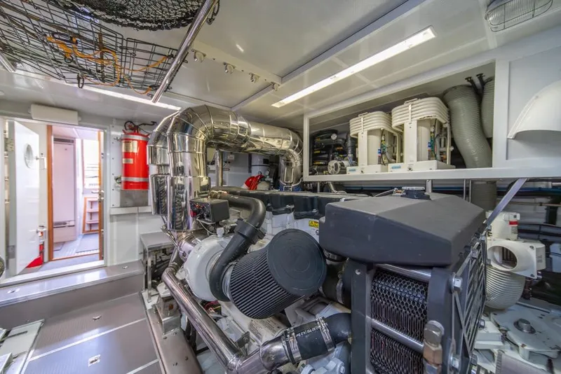 Slide: The Image of Engine room of 2009 Horizon 73 yacht, featuring machinery and equipment. - 85