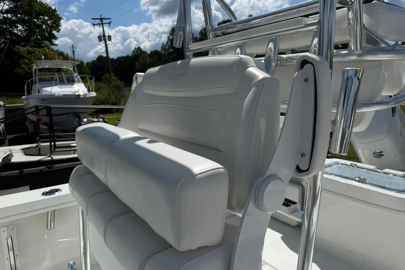 Slide: The Image of 2026 Pair Customs 27 Center Console boat with white seating and chrome details. - 9