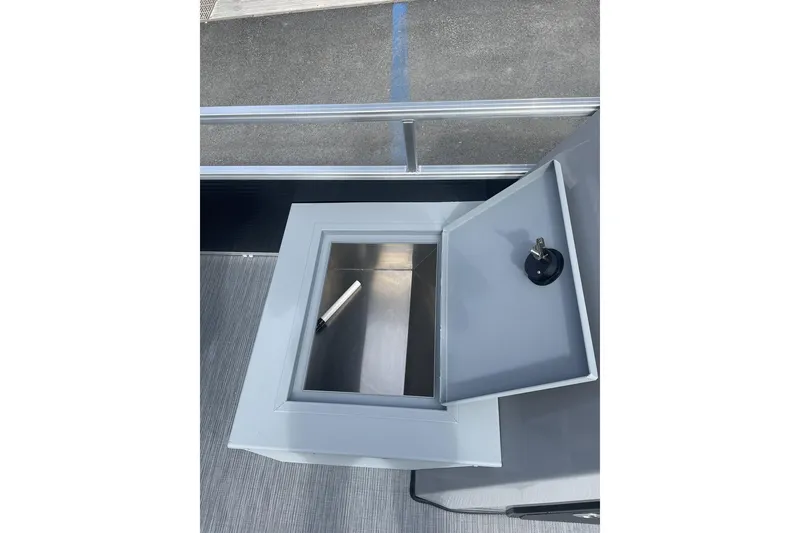 Slide: The Image of Open storage compartment on 2024 Lowe Ultra 162 Fish & Cruise boat. - 10
