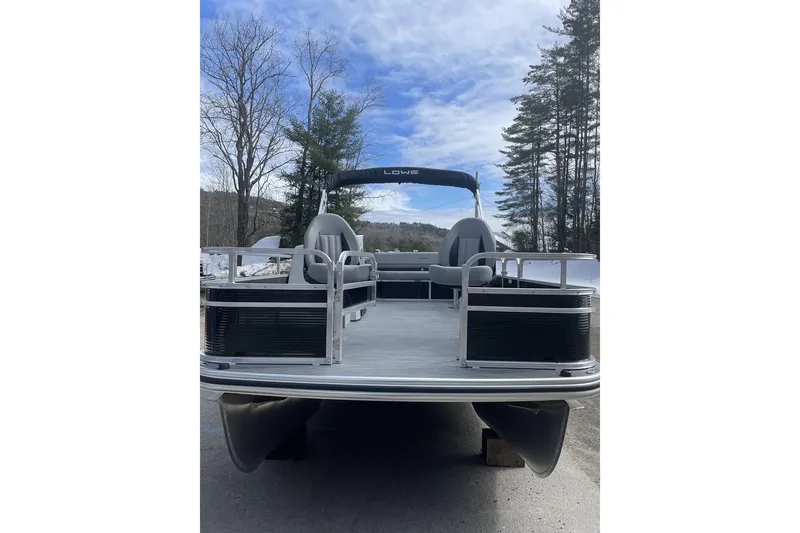 Slide: The Image of 2024 Lowe Ultra 162 Fish & Cruise pontoon boat on a clear day. - 3