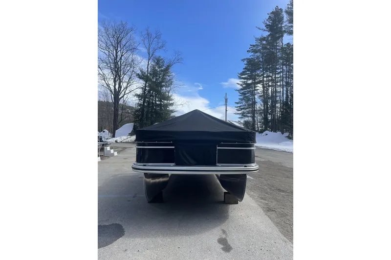 Slide: The Image of 2024 Lowe Ultra 162 Fish & Cruise boat with cover, parked on snowy pavement. - 6