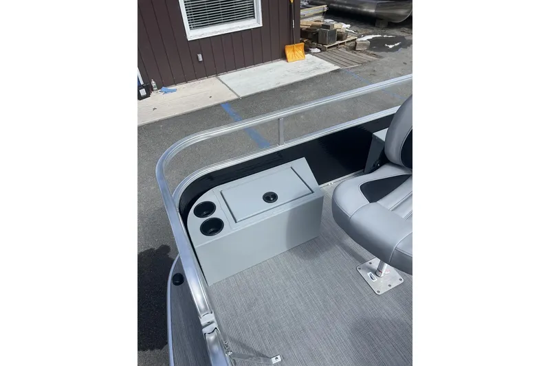 Slide: The Image of 2024 Lowe Ultra 162 Fish & Cruise boat interior with seating and cup holders. - 9