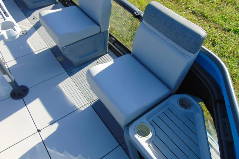 Slide: The Image of 2023 Sea-Doo Switch Cruise 21 interior seating with cup holders and sleek design. - 11