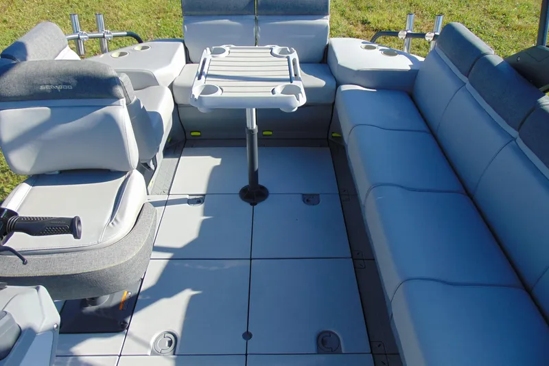 Slide: The Image of 2023 Sea-Doo Switch Cruise 21 interior with seating and table, showcasing comfort and design. - 13
