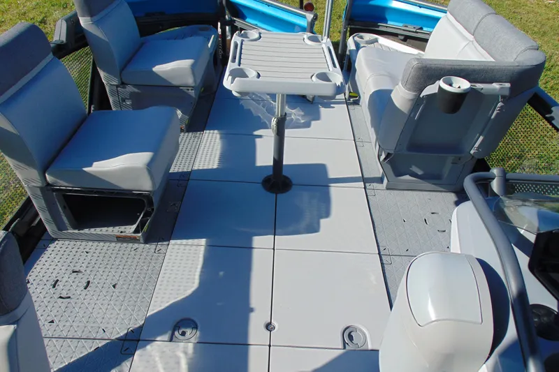 Slide: The Image of 2023 Sea-Doo Switch Cruise 21 interior with seating and table setup. - 16
