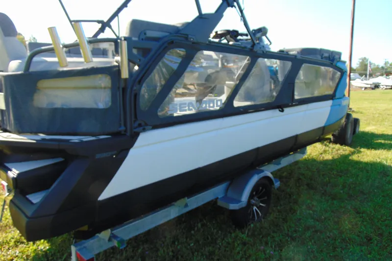 Slide: The Image of 2023 Sea-Doo Switch Cruise 21 on trailer, parked on grass. - 7