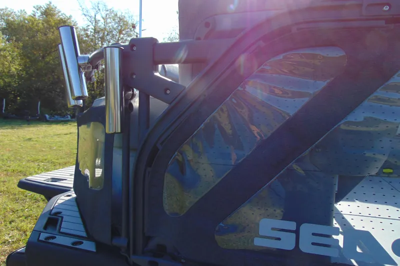 Slide: The Image of 2023 Sea-Doo Switch Cruise 21 boat detail with stainless steel components and sunlight reflections. - 8