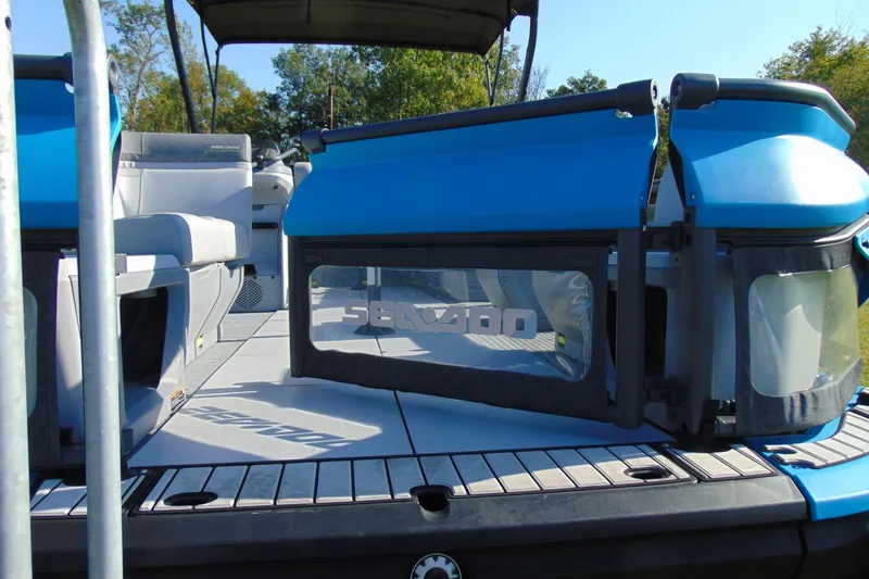 Slide: The Image of 2023 Sea-Doo Switch Cruise 21 pontoon boat interior with blue accents and seating. - 9