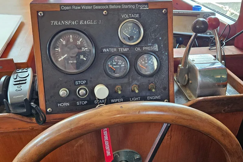 Slide: The Image of 1987 Transpacific Marine Eagle 32 dashboard with gauges and controls. - 19