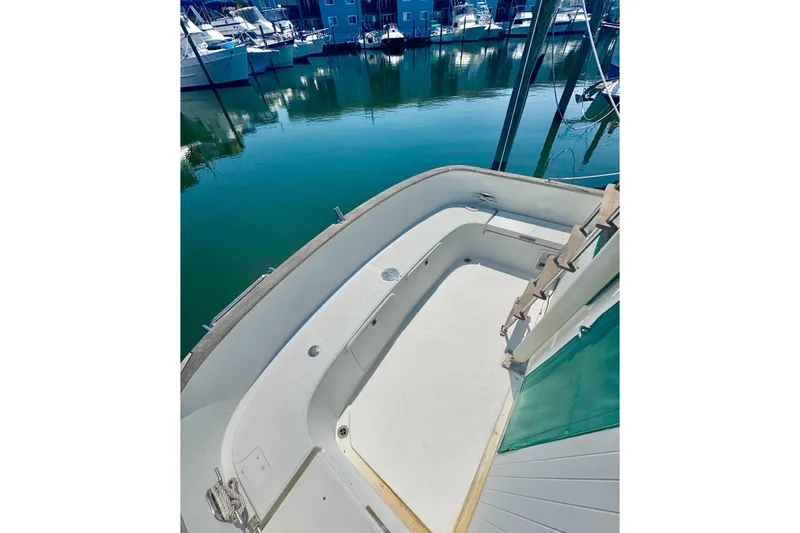 Slide: The Image of 1987 Transpacific Marine Eagle 32 boat deck, docked in a marina. - 30