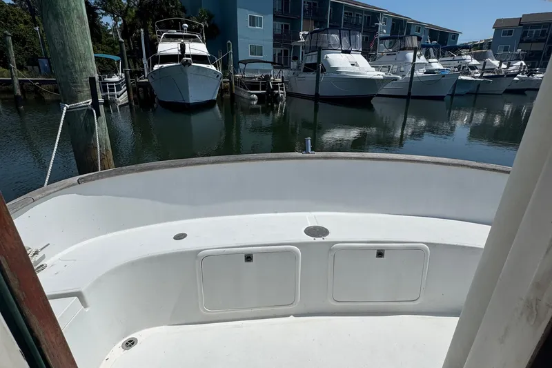 Slide: The Image of 1987 Transpacific Marine Eagle 32 boat docked in a marina with other vessels. - 31