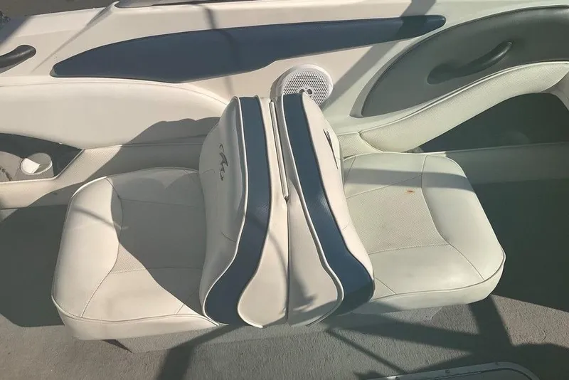 Slide: The Image of 2009 Monterey 180 FS boat interior with white and blue seating. - 19