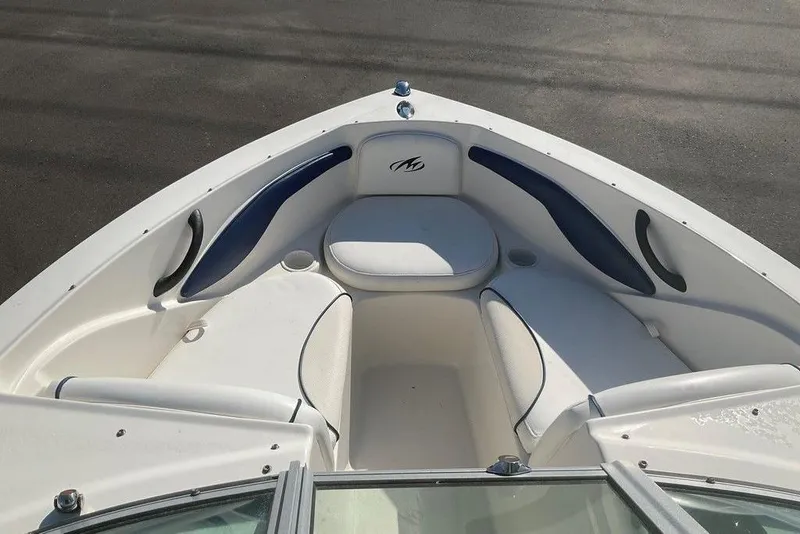 Slide: The Image of 2009 Monterey 180 FS boat interior with white and blue seating. - 20
