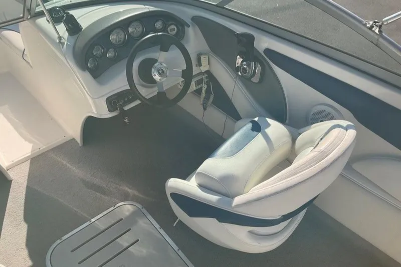 Slide: The Image of 2009 Monterey 180 FS boat interior with steering wheel and dashboard controls. - 8