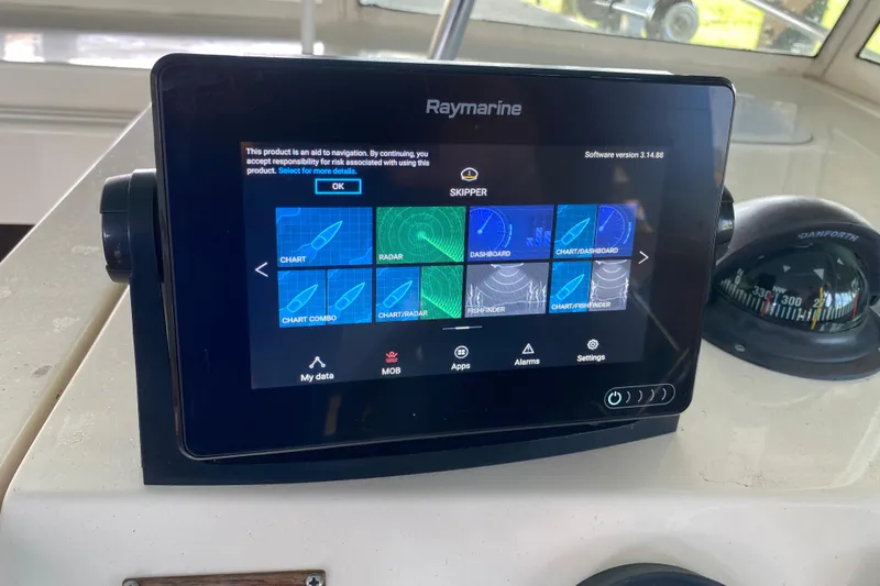 Slide: The Image of 2003 Mainship Pilot 30-II Sedan interior with throttle lever and control panel. - 15